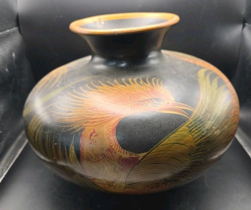 Hand carved and painted - and, black
